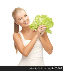 picture of healthy woman holding bunch of lettuce