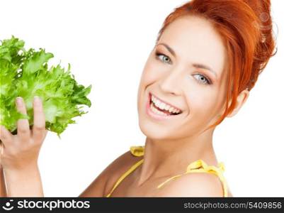 picture of healthy woman holding bunch of lettuce