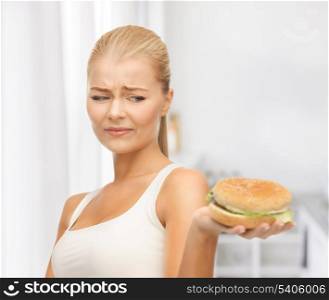 picture of healthy woman rejecting junk food