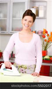 picture of ironing woman in the kitchen