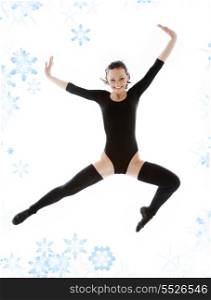 picture of jumping girl in black leotard with snowflakes