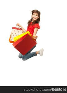 picture of jumping teenage girl with shopping bags