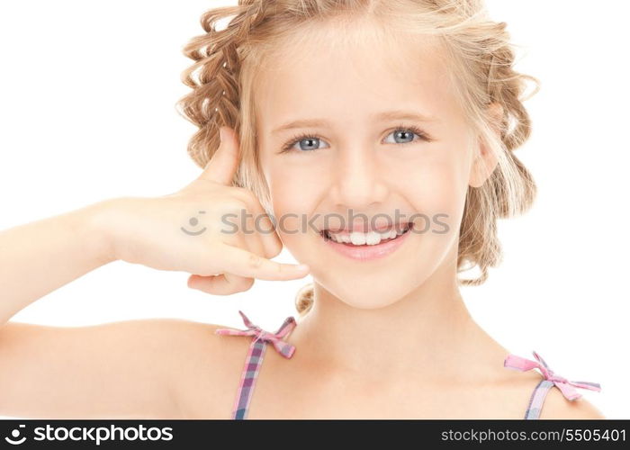 picture of little girl making a call me gesture&#xA;