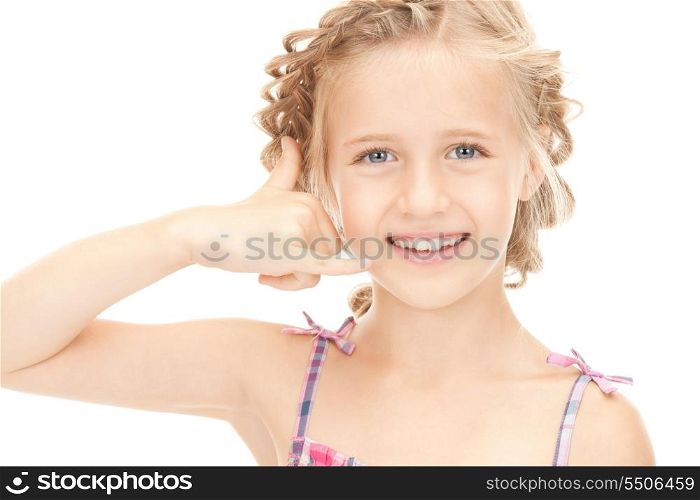 picture of little girl making a call me gesture&#xA;