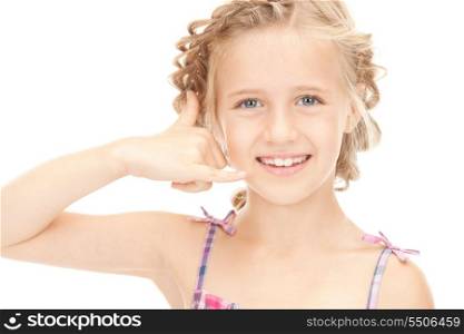 picture of little girl making a call me gesture&#xA;