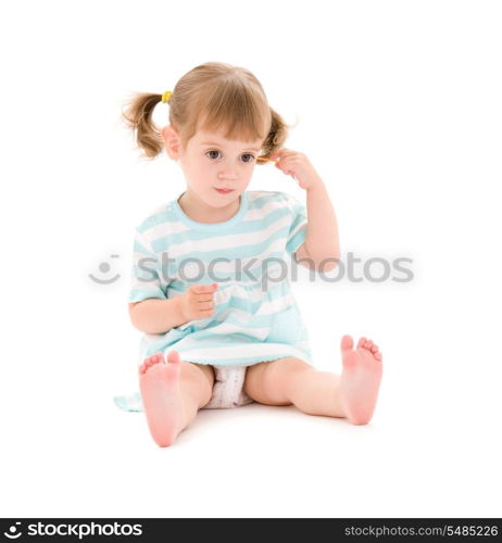 picture of little girl with cotton sticks over white