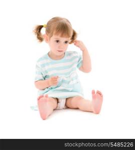 picture of little girl with cotton sticks over white