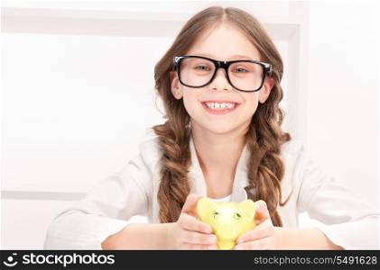 picture of little girl with piggy bank