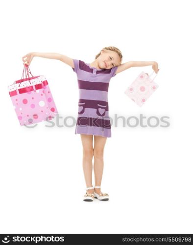 picture of little girl with shopping bags.