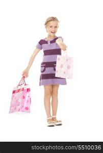 picture of little girl with shopping bags.