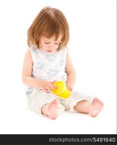 picture of little girl with yellow modelling foam over white