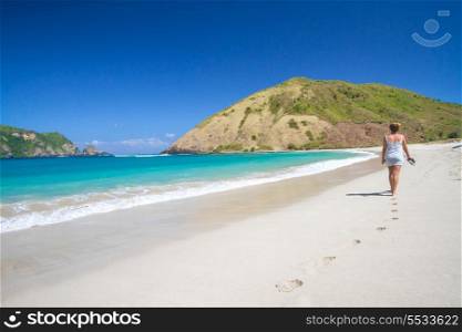 picture of long haired young woman on tropical beach.Lombok island.Indonesia.