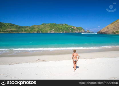 picture of long haired young woman on tropical beach.Lombok island.Indonesia.