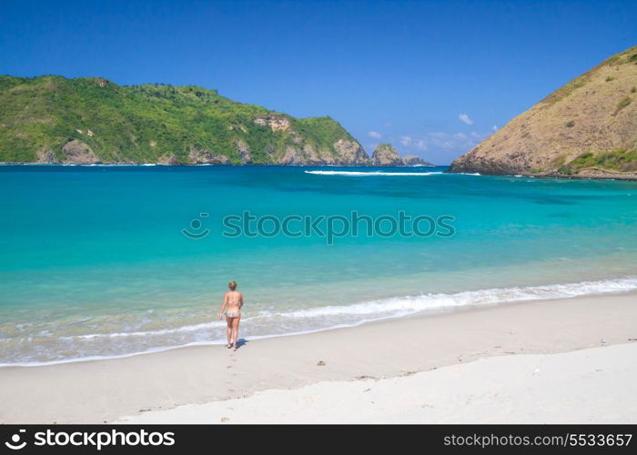picture of long haired young woman on tropical beach.Lombok island.Indonesia.
