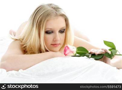picture of lovely blond with rose laying in bed
