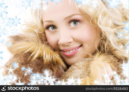 picture of lovely blonde in fur with snowflakes