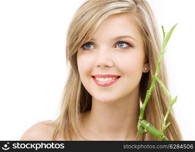 picture of lovely blue-eyed blonde with bamboo