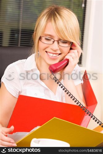 picture of lovely girl with phone in office