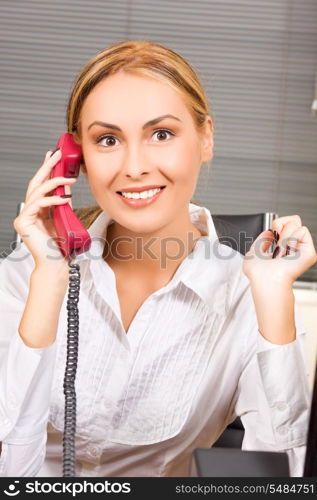 picture of lovely girl with phone in office