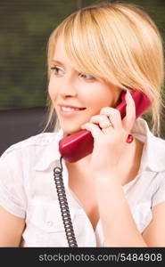 picture of lovely girl with phone in office