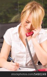 picture of lovely girl with phone in office