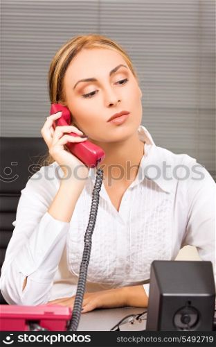 picture of lovely girl with phone in office