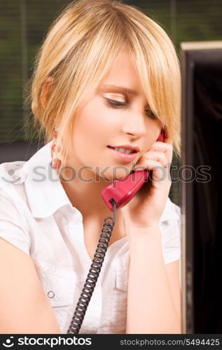 picture of lovely girl with phone in office