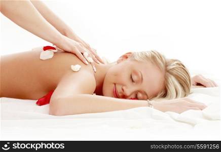 picture of lovely lady with flower petals in massage salon