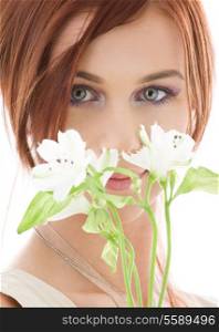 picture of lovely redhead with flowers over white