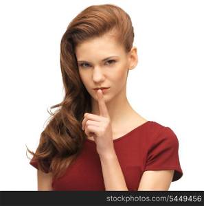 picture of lovely teenage girl in red dress with finger on lips