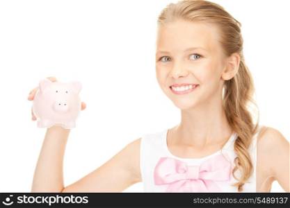 picture of lovely teenage girl with piggy bank