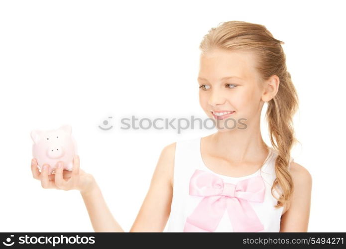 picture of lovely teenage girl with piggy bank