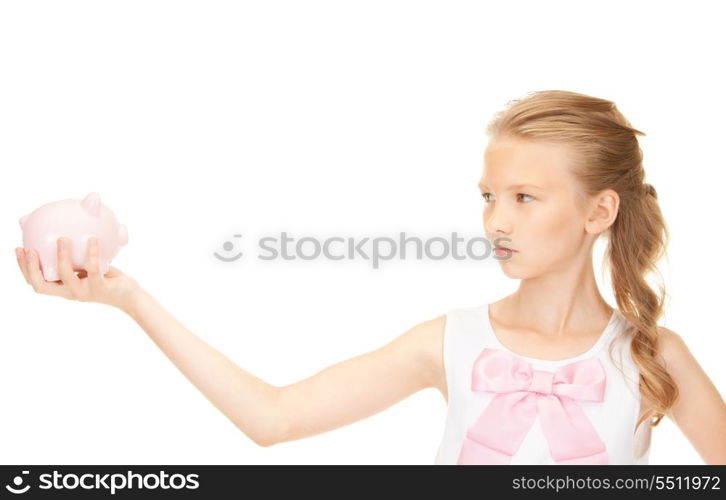 picture of lovely teenage girl with piggy bank