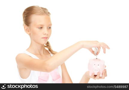 picture of lovely teenage girl with piggy bank and money