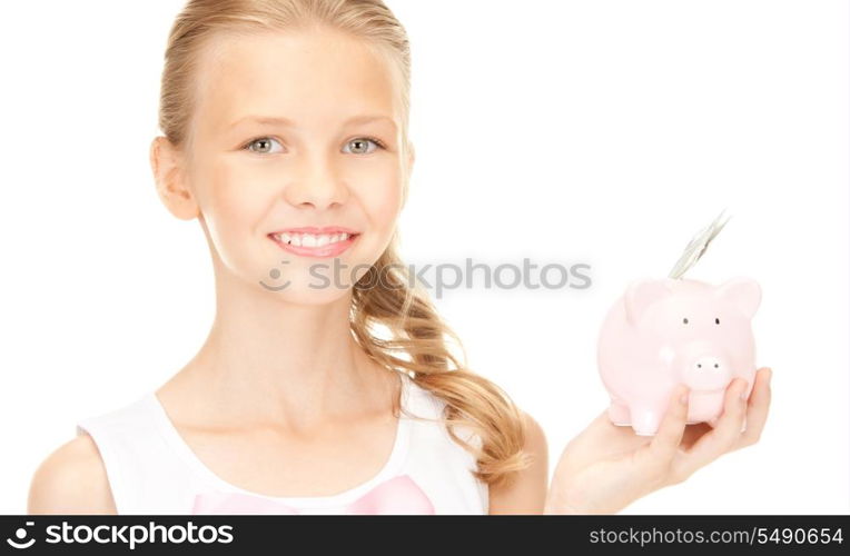 picture of lovely teenage girl with piggy bank and money