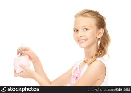 picture of lovely teenage girl with piggy bank and money