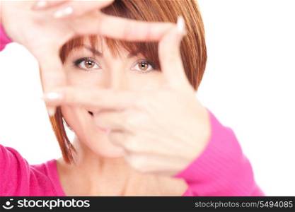 picture of lovely woman creating a frame with fingers&#xA;