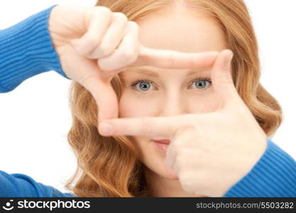 picture of lovely woman creating a frame with fingers&#xA;