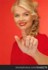 picture of lovely woman in red dress pressing virtual button