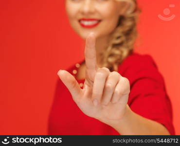 picture of lovely woman in red dress pressing virtual button