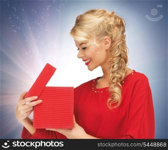 picture of lovely woman in red dress with opened gift box
