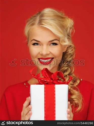 picture of lovely woman in red dress with present