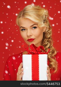 picture of lovely woman in red dress with present