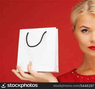 picture of lovely woman in red dress with shopping bag