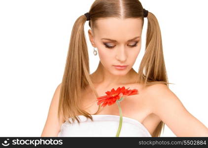 picture of lovely woman in towel with red flower