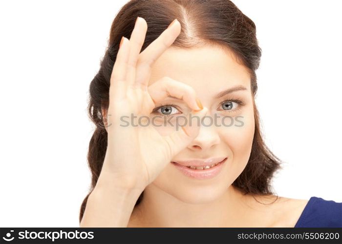 picture of lovely woman looking through hole from fingers