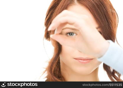 picture of lovely woman looking through hole from fingers