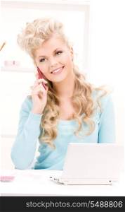 picture of lovely woman with cell phone and computer