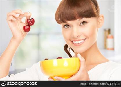 picture of lovely woman with cherries in kitchen