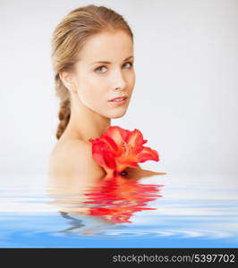 picture of lovely woman with lily flower in water
